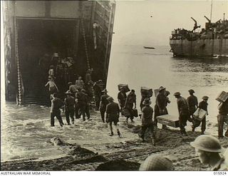 Finschhafen, New Guinea. 1943-09. Australian troops unloading supplies at a beach six miles from Finschhafen preparatory to carrying out an attack on Japanese positions in the area