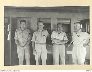 MADANG, NEW GUINEA. 1944-10-31. THE INTELLIGENCE OFFICE STAFF ABOARD THE HMAS PING WO, AN OLD CHINESE RIVER STEAMER NOW BEING USED AS AN OFFICE FOR THE RAN ADMINISTRATION STAFF