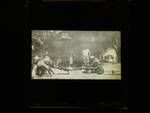 Man lying on box while four men pull at his arms and legs, New Guinea?, c1924 to ?