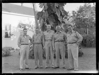 Unidentified RNZAF men outside a hotel, Rarotonga, Cook Islands