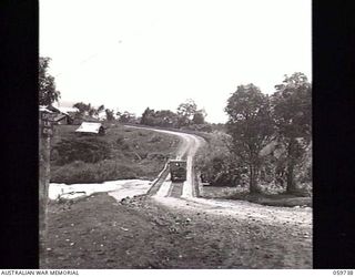 DONADABU, NEW GUINEA. 1943-11-03. NEW BRIDGE OVER THE LALOKI RIVER WHICH WAS BUILT BY SAPPERS OF THE 24TH AUSTRALIAN FIELD COMPANY, ROYAL AUSTRALIAN ENGINEERS OPPOSITE THE 25TH AUSTRALIAN INFANTRY ..