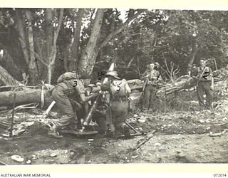 KILIGIA, PAPUA, NEW GUINEA. 1944-04-03. TROOPS OF THE 101ST BRIGADE SUPPORT COMPANY, HEADQUARTERS 5TH DIVISION BEING TIMED DURING THE MOUNTING OF A 4.2 INCH MORTAR FOR EXPERIMENTAL PURPOSES