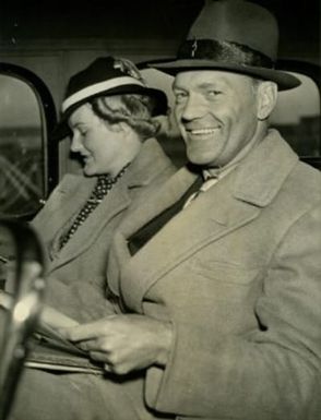 Black and white photograph of Doris Duke and James Cromwell on drive to San Francisco, after flight from Hawaii, 1937