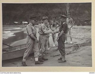 BUT-DAGUA AREA, NEW GUINEA. 1945-04-12. SENATOR J.M. FRASER, ACTING MINISTER FOR THE ARMY (2), AND LIEUTENANT GENERAL J. NORTHCOTT, CHIEF OF THE GENERAL STAFF (1), BEING WELCOMED BY MAJOR GENERAL ..