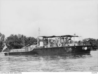 AITAPE, NORTH EAST NEW GUINEA. C. 1945. GROUP PORTRAIT ON DECK OF THE SHIP'S COMPANY OF THE RAAF AIR-SEA RESCUE LAUNCH NO. 03-13: WARRANT OFFICER LESTER CRIBB, COXSWAIN; SERGEANT CLIFF WINCH, FIRST ..