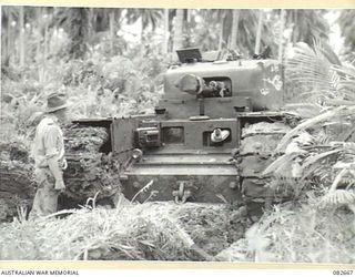 MILILAT, NEW GUINEA. 1944-10-12. 'THE STORK', A CHURCHILL V TANK BOGGED DURING A TANK TEST AT HQ 4 ARMOURED BRIGADE