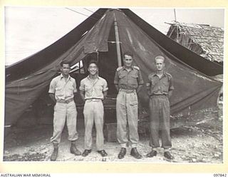 CAPE WOM, WEWAK AREA, NEW GUINEA. 1945-10-13. MEMBERS OF THE ALLIED TRANSLATOR AND INTELLIGENCE SERVICE STAFF, HEADQUARTERS 6 DIVISION. IDENTIFIED PERSONNEL ARE:- TECHNICAL SERGEANT G.H. TANDO, US ..