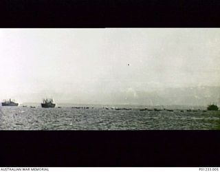 GUADALCANAL, SOLOMON ISLANDS, 1942-08-07. INVASION BARGES LOADED WITH UNITED STATES MARINES LEAVE TROOP TRANSPORTS FOR THE LANDING AT TULAGI
