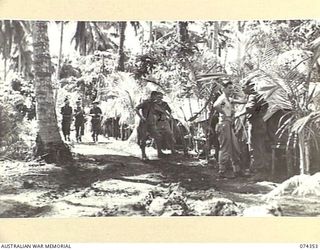 SIAR, NEW GUINEA. 1944-06-25. TROOPS RELAXING AND YARNING IN THE TENT LINES OF THE AREA OCCUPIED BY NO.6 PLATOON, HEADQUARTERS COMPANY, 57/60TH INFANTRY BATTALION. IDENTIFIED PERSONNEL ARE:- ..