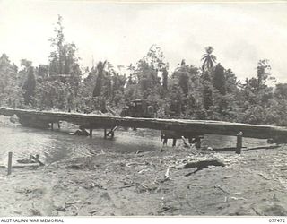 AITAPE AREA, NEW GUINEA. 1944-12-04. A BRIDGE ACROSS SOLUM CREEK BUILT BY ENGINEERS OF NO. 10 PLATOON, 2/14TH FIELD COMPANY, ON THE AITAPE-DOGRETO ROAD