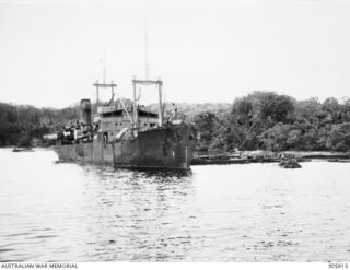 ORO BAY, NEW GUINEA. 1943. THE DUTCH TRANSPORT BANTAM ALONGSIDE THE JETTY DURING OPERATION LILLIPUT. (NAVAL HISTORICAL COLLECTION)