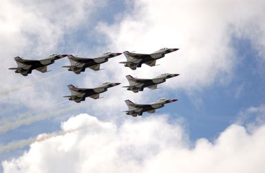 The U.S. Air Force Thunderbirds Aerial Demonstration Team F-16C Fighting Falcon aircraft perform during the Open House Air Show, Sept. 12, 2004, at Andersen Air Force Base, Guam. (U.S. Air Force PHOTO by AIRMAN 1ST Class Kristin Ruleau). (Released)