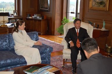 Assistant Secretary for Policy, Management, and Budget, P. Lynn Scarlett, left, with visiting Governor of Guam, Felix Camacho, center, at Department of Interior headquarters meeting