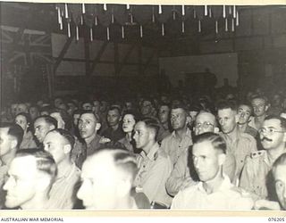 LAE, NEW GUINEA. 1944-09-26. A SECTION OF THE LARGE AUDIENCE WHICH ATTENDED THE CONCERT STAGED BY THE "TANKS A MILLION" CONCERT PARTY AT THE OPENING CEREMONY IN THE RECREATION HALL BUILT BY MEMBERS ..