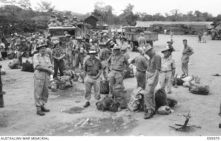 LAE, NEW GUINEA, 1945-11-20. TROOPS OF LAE BASE SUB AREA WAITING TO EMBARK ON THE TROOPSHIP MV DUNTROON FOR RETURN TO AUSTRALIA
