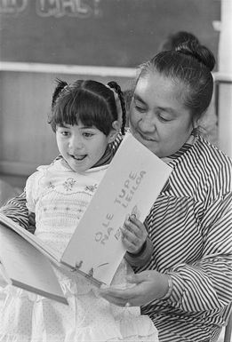 Samoan playschools administrator Fereni Ete, reading a story in Samoan to Fuatina Mapu at the Samoan A'oga Amata, (beginning school) at Strathmore Park School, Wellington - Photograph taken by Martin Hunter