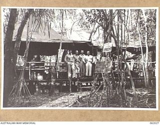 DREGER HARBOUR, NEW GUINEA. 1943-12-06. MEDICAL DISPENSARY OF THE 870TH UNITED STATES AVIATION ENGINEER BATTALION. SHOWN ARE: CAPTAIN DAVID J. COHEN OF PENNSYLVANIA, USA, (1); CAPTAIN WILLIAN J. ..