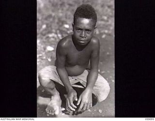 BUKAUA, NEW GUINEA. 1943-10-18. PORTRAIT OF BONO A VOLUNTEER FOR THE AUSTRALIAN AND NEW GUINEA ADMINISTRATION UNIT LABOUR FORCE, REJECTED BECAUSE HE WAS UNDER AGE