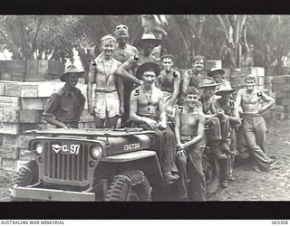 SIALUM, NEW GUINEA. 1944-01-07. MEMBERS OF THE 2/156TH GENERAL TRANSPORT COMPANY AND THE 2/6TH SUPPLY DEPOT COMPANY, COVERED IN DUST ON THEIR ARRIVAL AT THE DETAILS ISSUING DEPOT AFTER DELIVERING ..