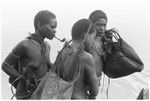 Trading with saltwater (coastal) women in the canoes. Bush women