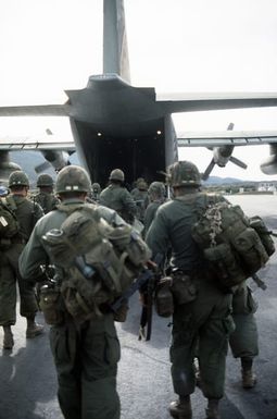 25th Infantry Battalion troops embark a 439th Tactical Airlift Wing C-130 Hercules aircraft ready to depart during Joint Airborne Airportability Tactical Training