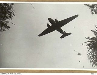 NEW GUINEA, 1943-08-01. "KAI" OR "BISCUIT" BOMBERS WERE USED TO CARRY SUPPLIES OF FOOD AND AMMUNITION TO FORWARD TROOPS IN INACCESSIBLE AREAS. NOTE - KAI IS THE NATIVE WORD FOR FOOD. PHOTOGRAPH ..