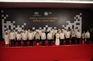 Barack Obama joins Asia Pacific Economic Cooperation Summit leaders and spouses for a group photo in Pasay, Metro Manila, Philippines, November 18, 2015