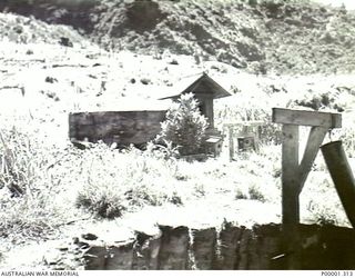 NEW BRITAIN, 1945-09. REMAINS OF A JAPANESE UTILISED STRUCTURE IN THE RABAUL AREA. (RNZAF OFFICIAL PHOTOGRAPH.)