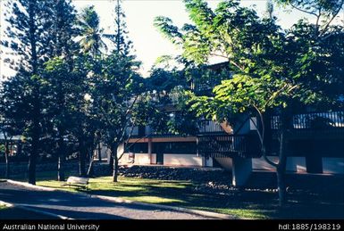 New Caledonia - white building with black balconies, gardens