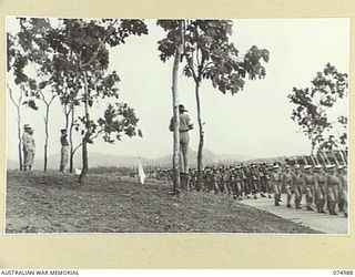 PORT MORESBY, PAPUA. 1944-08-05. MAJOR GENERAL B.M. MORRIS, DSO GENERAL OFFICER COMMANDING, AUSTRALIAN NEW GUINEA ADMINISTRATIVE UNIT TAKING THE SALUTE AT THE CONCLUSION OF THE OFFICIAL OPENING ..