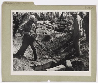 Photograph of Coast Guardsmen at Foxhole Entrance