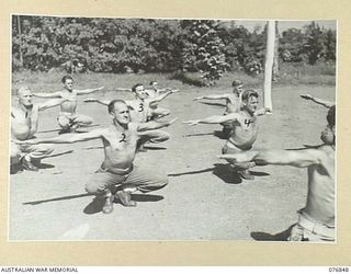 LAE, NEW GUINEA. 1944-11-11. CONVALESCING PATIENTS OF THE 112TH CONVALESCENT DEPOT DOING THEIR PHYSICAL TRAINING EXERCISES UNDER THE EYES OF ONE OF THE UNIT INSTRUCTORS