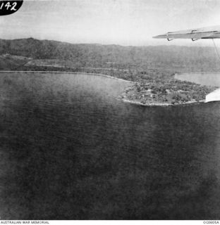 WEWAK, NEW GUINEA. C. 1944. AERIAL VIEW OF WEWAK AIR FIELD (LOOKING SOUTH) WITH WEWAK TOWN ON THE LOW PROMONTORY