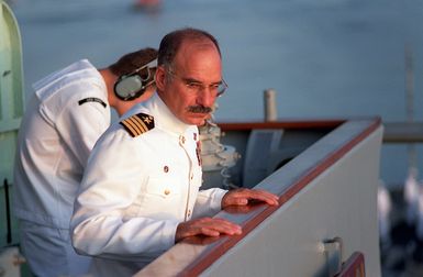 The commanding officer of the guided missile cruiser USS CHOSIN (CG-65) looks down from the bridge wing as the ship approaches the USS ARIZONA MEMORIAL during the observance commemorating the 50th anniversary of the Japanese attack on Pearl Harbor