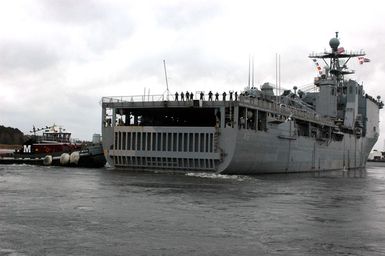 U.S. Navy Sailors of Whidbey Island Class Dock Landing Ship USS ASHLAND (LSD 48) man the rails as the ship gets underway from Naval Amphibious Base Little Creek on November 16, 2006. The ASHLAND will relieve Tarawa Class Amphibious Assault Ship USS SAIPAN (LHA 2) in the 5th Fleet area of responsibility. (U.S. Navy photo by Mass Communication SPECIALIST SEAMAN John Suits) (Released)