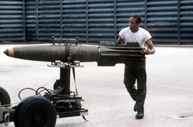 Personnel of the 43rd Munitions Maintenance Squadron prepares to load a Mark 82 500-pound high-drag bomb aboard a B-52G Stratofortress aircraft of the 60th Bomber Squadron during Exercise HARVEST COCONUT