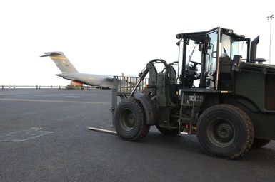 Earthquake ^ Tsunami - Pago Pago, American Samoa, October 2, 2009 -- A fork lift prepare to unload FEMA generators have been shipped to American Samoa by a C-17 military cargo plane. FEMA shipped generators from its warehouses to American Samoa to help provide electric power to critical facilities in American Samoa.