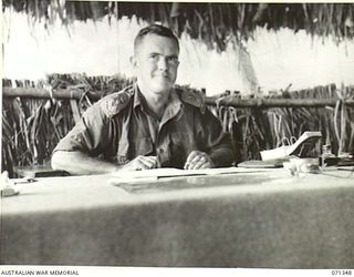 KILIGIA, NEW GUINEA, 1944-03-16. VX27 MAJOR-GENERAL A.H. RAMSAY, CBE, DSO, ED, GOC HEADQUARTERS, 5TH DIVISION, AT HIS DESK