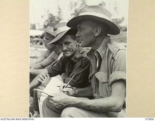 SOUTH ALEXISHAFEN, NEW GUINEA. 1944-09-10. VX20824 STAFF SERGEANT J. HOMER (1) AND QX44566 PRIVATE J. FEENEY (2) SCORING DURING THE CRICKET MATCH BETWEEN TEAMS FOR HEADQUARTERS, 5TH DIVISION AND ..