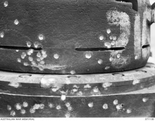 GUSIKA, NEW GUINEA. 1944-03-15. THE EFFECTS OF SMALL ARMS FIRE, INCLUDING JAPANESE RIFLES, THE OWEN SUBMACHINE GUN AND THE BREN GUN ON AN ALL ROUND VISION CUPOLA FITTED TO THE BODY OF A MATILDA ..