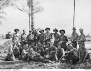 PALMALMAL PLANTATION, NEW BRITAIN. 1944-11-29. TROOPS OF THE 17TH FIELD COMPANY, 48TH DEPUTY COMMANDER, ROYAL ENGINEERS (WORKS) ENJOY A MORNING TEA BREAK DURING THE UNLOADING OF ENGINEER STORES. ..