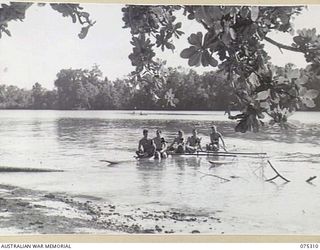 NAGADA, NEW GUINEA. 1944-08-16. PERSONNEL OF E TROOP, 22ND BATTERY, 106TH TANK ATTACK REGIMENT ENJOYING SOME FUN IN THEIR LAKATOI DURING ONE OF THE UNIT STAND DOWN PERIODS. IDENTIFIED PERSONNEL ..