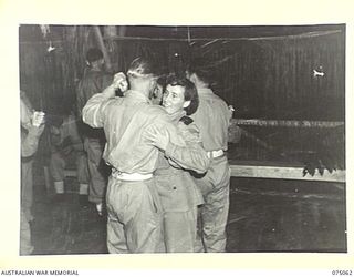 LAE, NEW GUINEA. 1944-08-09. PERSONNEL OF THE 2/7TH AUSTRALIAN GENERAL HOSPITAL, THE 2/8TH AUSTRALIAN GENERAL HOSPITAL AND THE 2/11TH AUSTRALIAN GENERAL HOSPITAL ENJOYING THEMSELVES AT A DANCE ..