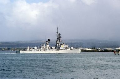 A starboard quarter view of the guided missile destroyer USS JOSEPH STRAUSS (DDG 16) entering the harbor