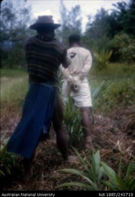 Tied up man being led around, Kaa