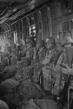 Members of Company E, Battalion Landing Team, 2nd Battalion, 3rd Marines, prepares to debark from a helicopter for an assault on the Kahukus Training Area during a combat readiness evaluation exercise. The Marines are stationed at Marine Corps Air Station, Kaneohe Bay