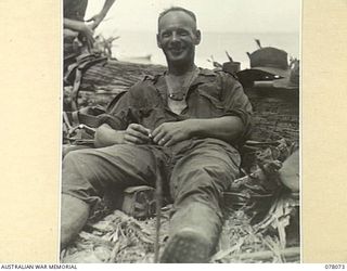 DANMAP RIVER AREA, NEW GUINEA. 1944-12-31. WX12923 PRIVATE A. MONTY, NO 7 PLATOON, A COMPANY 2/11TH INFANTRY BATTALION, RELAXING DURING A BREAK IN OPERATIONS AGAINST JAPANESE FORCES IN THE AREA