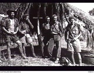 DUMPU, NEW GUINEA. 1943-10-15. WALKING WOUNDED, PATIENTS FROM THE 2/6TH AUSTRALIAN FIELD AMBULANCE, WAITING ON THE AIRSTRIP FOR THE EVACUATION AIRCRAFT