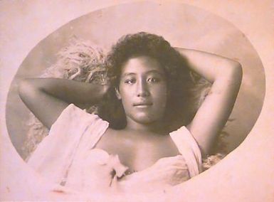 Samoan woman reclining on 'ie sina