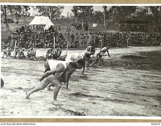 NEW GUINEA. 1943-11-20. COMPETITORS IN THE 100 YARDS CHAMPIONSHIP GETTING OFF THE MARK TO A GOOD START AT THE 18TH AUSTRALIAN INFANTRY BRIGADE SPORTS MEETING WHICH THEY HELD TO CELEBRATE THE FOURTH ..